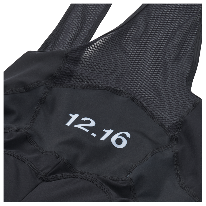 Black Bibs outfit with '12.16' printed on it, 