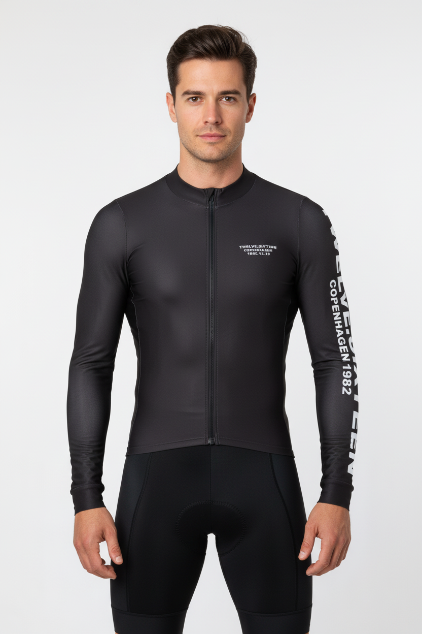 Man wearing a black cycling Long Jersey with visible TwelveSixteen branding 