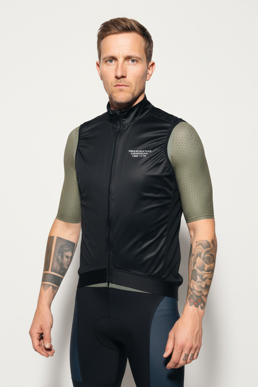 Man wearing a black cycling vest with green jersey